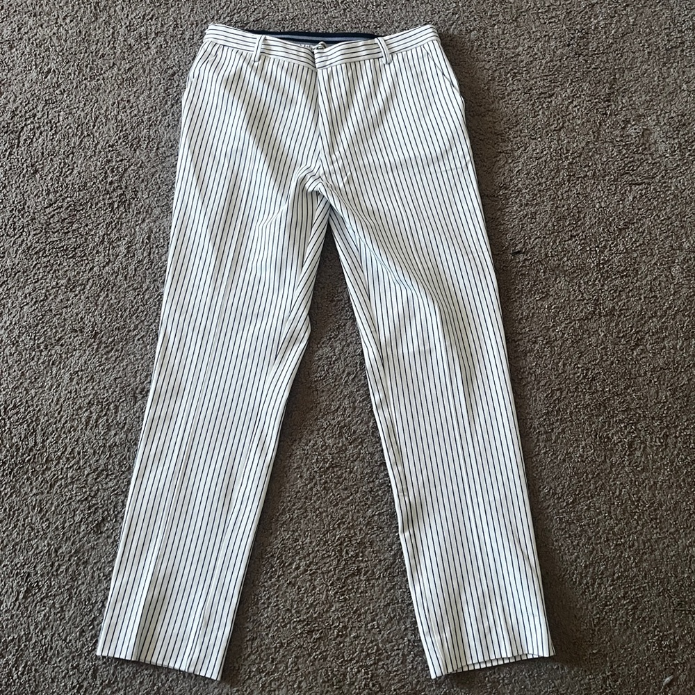 White pants with black pinstripes sized us large and Mexican 30.